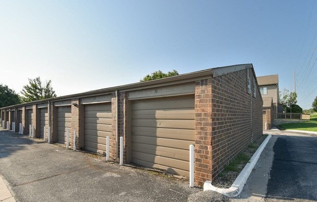 a row of garages on the side of a street