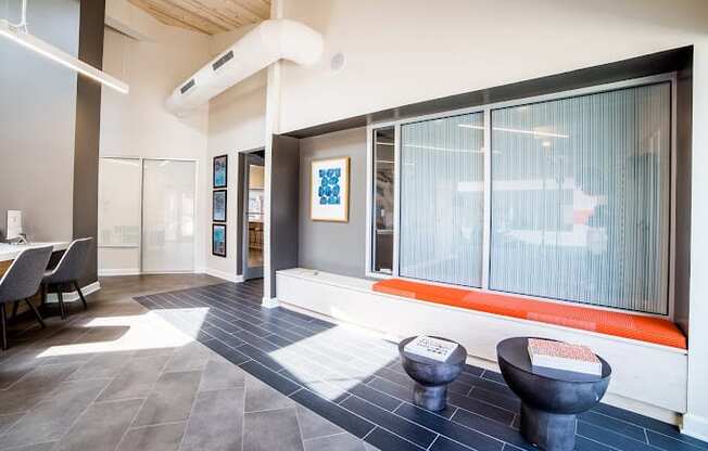 a room with a large window and two toilets