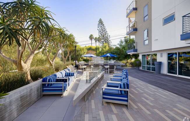 a lounge area with blue chairs