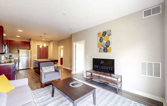 a living room with a couch and a table and a fireplace