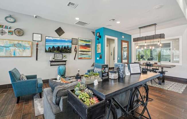 A blue chair sits in a room with a wooden floor.