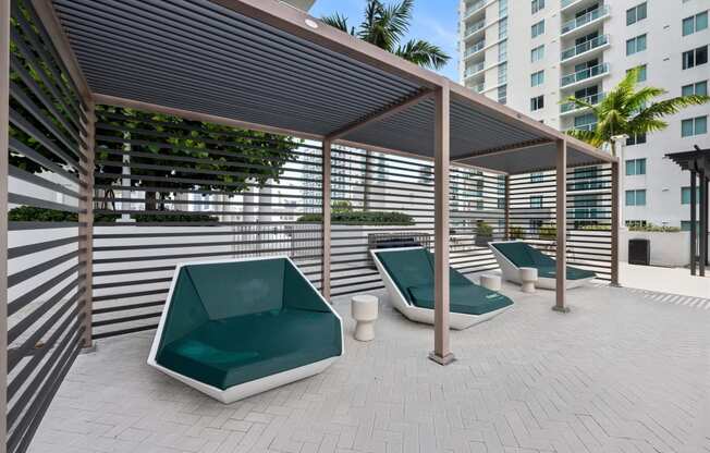 a patio with couches and a pergola