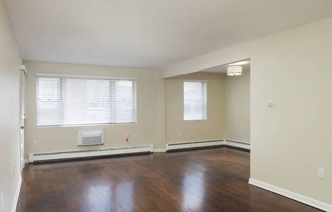 an empty living room with wood floors and a window at The Packard, West Hartford, Connecticut