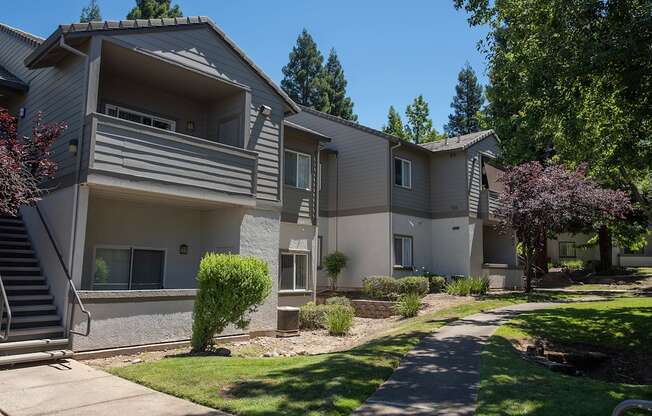Apartment complex with a staircase leading to the entrance at Sunset Summit, Rocklin, CA, 95765