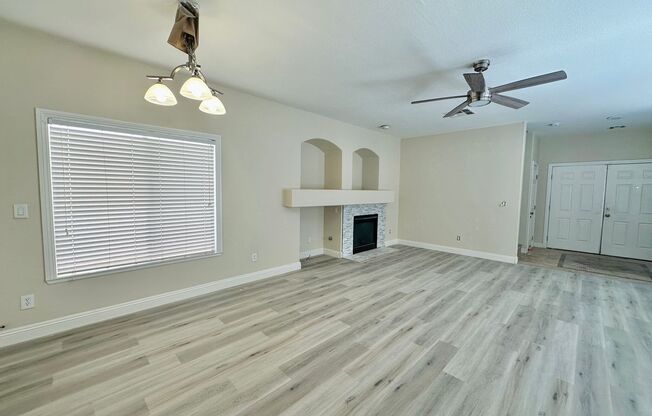 Newly renovated beautiful two story house with brand new vinyl plank flooring, an extra long driveway, and a covered front patio!