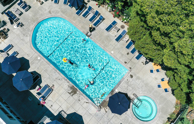 A large swimming pool with people in it.
