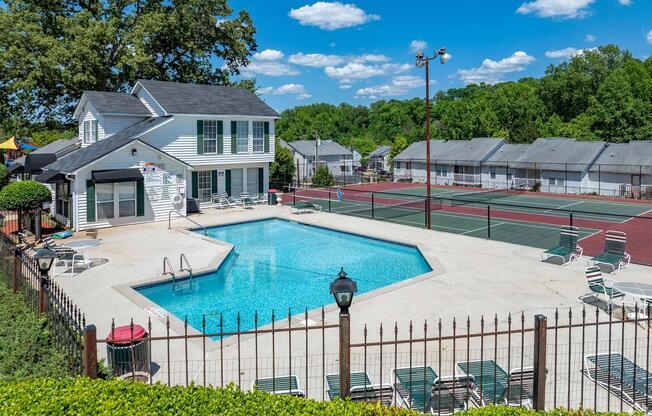 a pool next to a fence