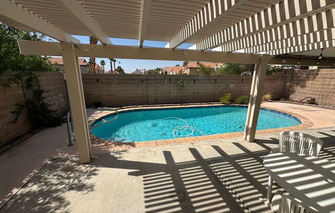 Two story home with sparkling private pool.