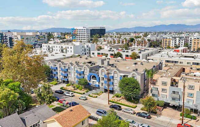 A cityscape with buildings and cars.
