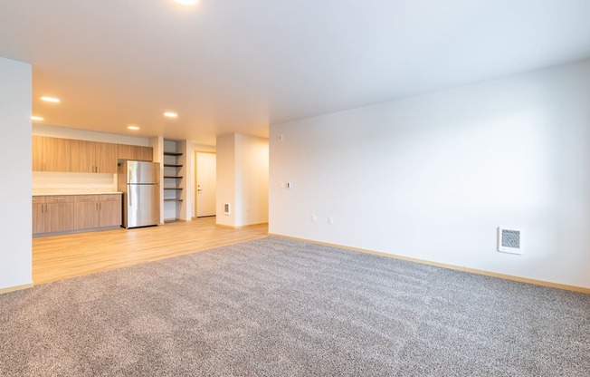 Spacious Living Room with Carpet and kitchen view