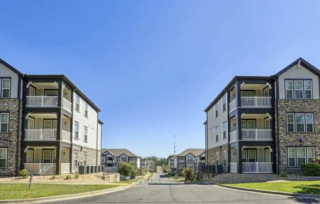 View of rows of our apartment buildings on a sunny day at Evergreen at Southwood in Tallahassee, FL