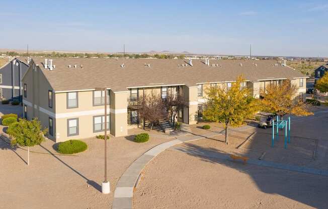 Apartment complex with a playground in the front.