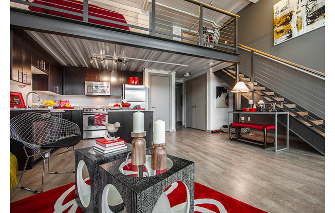 A modern kitchen with a red rug on the floor.