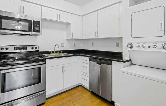 Kitchen with Stainless Steel Appliances and In-home Washer and Dryer