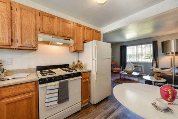  Kitchen with View of Living Room,  Hardwood Inspired Floors, Oven and Wood Cabinets