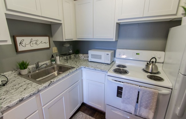 This is a picture of the kitchen in a 549 square foot 1 bedroom, 1 bath apartment at Romaine Court Apartments in the Oakley neighborhood of Cincinnati, Ohio.