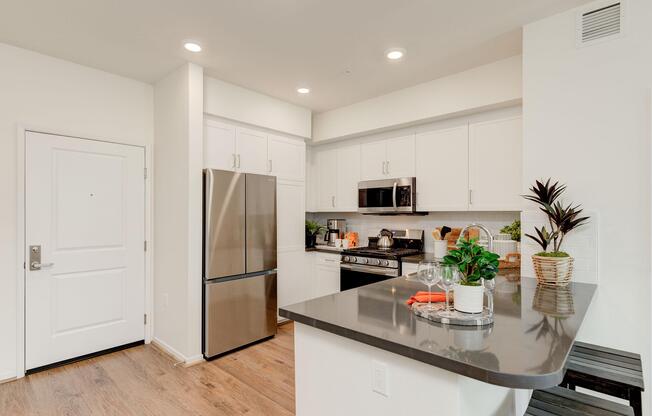 a kitchen with a stove and a refrigerator