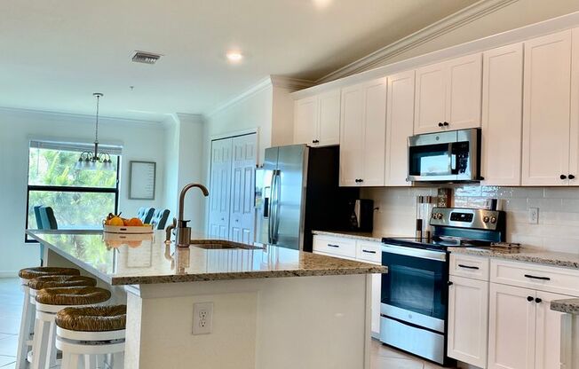 FURNISHED RENTAL!2/2/ CONDO W/ DEN/GARAGE AT "THE NATIONAL" AT LAKEWOOD RANCH