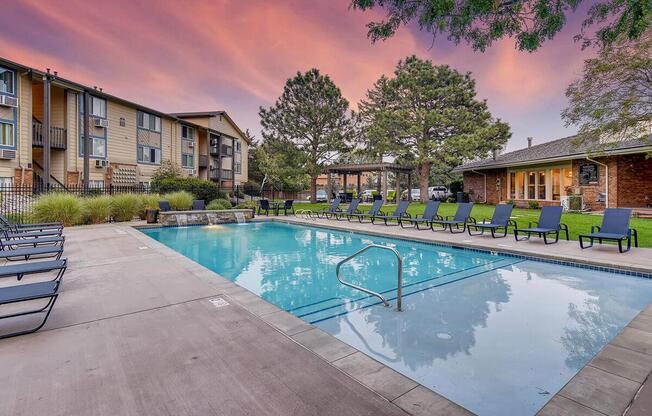 a house with a pool outside of a building