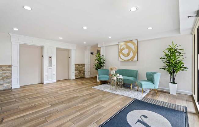A living room with a blue rug and a coffee table.