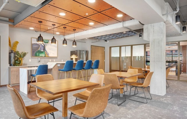 a dining room with tables and chairs and a bar