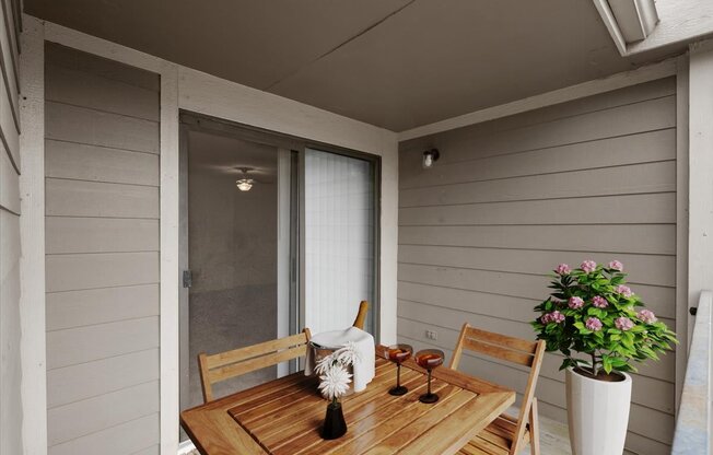a patio with a wooden table and chairs and a sliding glass door
