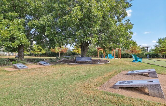 A park with a playground and a bench.