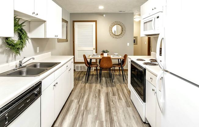 Two bedroom apartment homes with large kitchens and plank flooring at Flatwater in Omaha, NE