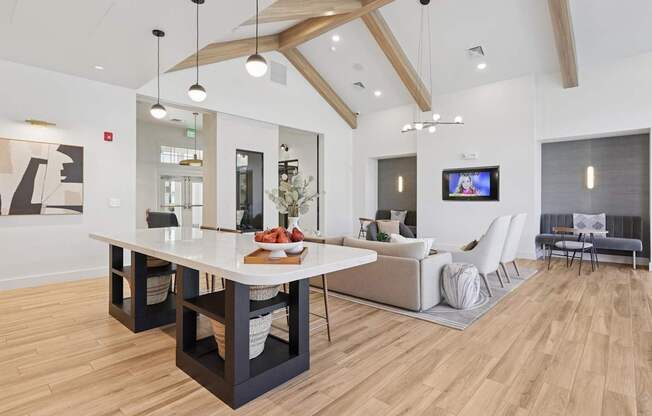 A modern living room with a white dining table and a television.