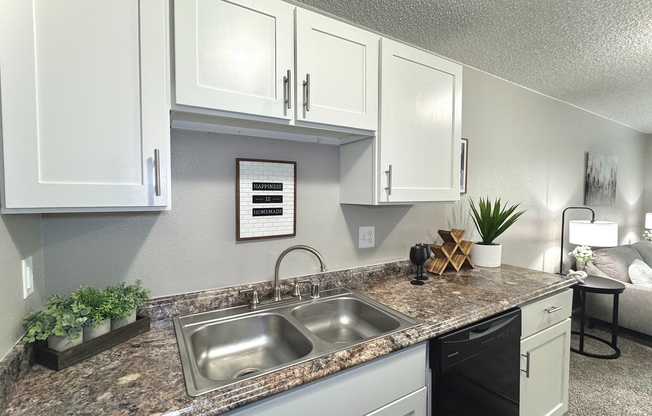 Cook up your favorite meals in a kitchen that’s as stylish as it is functional, complete with sleek, black appliances.