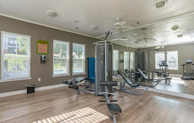 the residence apartments fitness room with exercise equipment