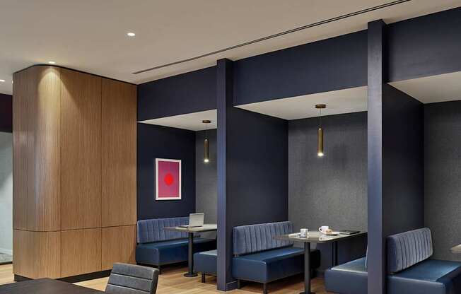 A conference room with a long table and chairs.
