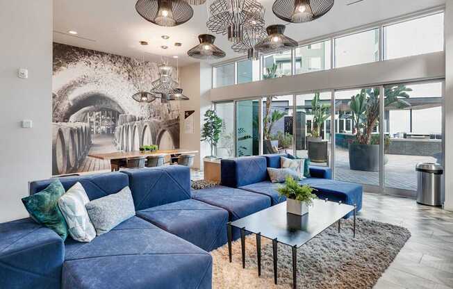 A living room with a blue couch and a coffee table.