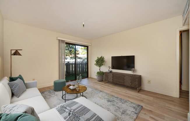 a living room with a couch and a tv