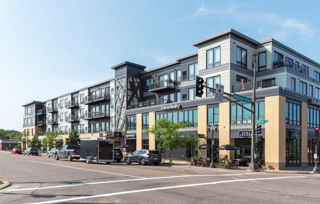 A street view of a multi-story building with the sign