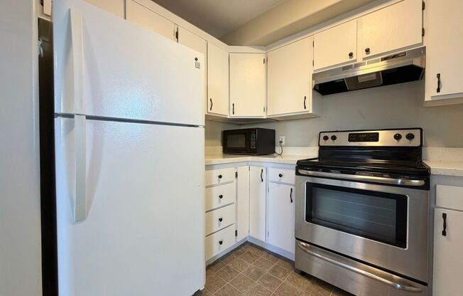 OCTOBER IS FREE!! 3-Bedroom Townhome with 2-Car Garage, Fenced Yard & In-Unit Laundry!