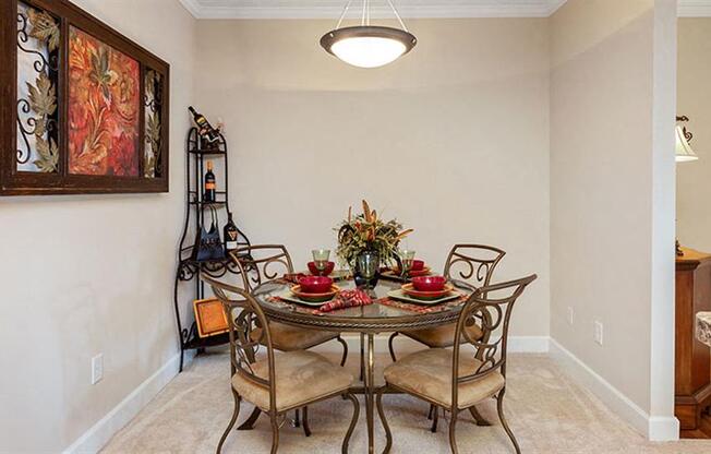 a dining room with a table and chairs at Bedford Parke Apartments, Georgia, 31088