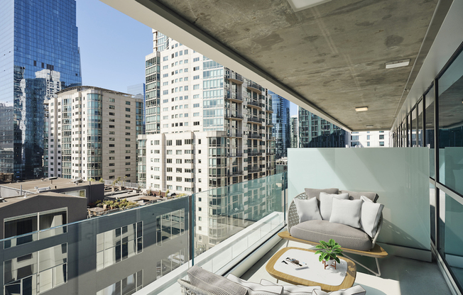 Enjoy a night in on your private balcony with downtown views!