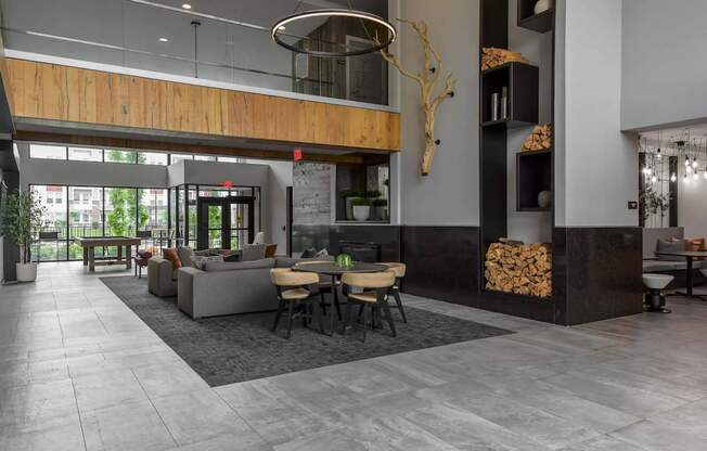 A modern living room with a fireplace and a dining table.