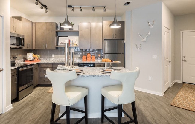 eat-in kitchen with pendant lighting over island