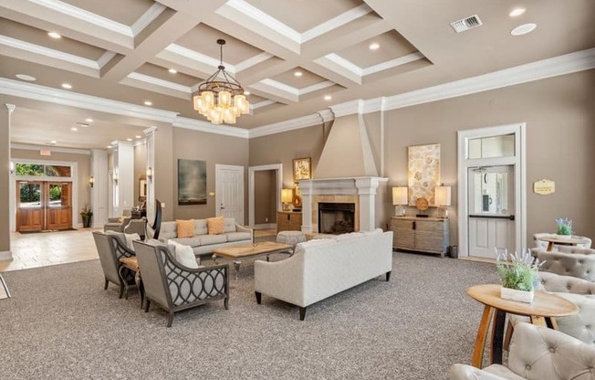 a living room with couches and chairs and a fireplace