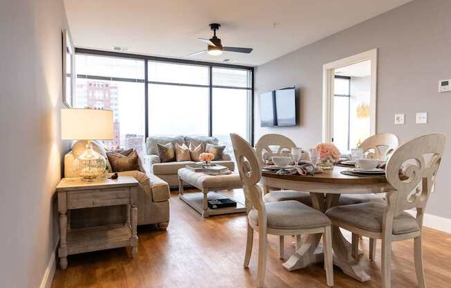 A well-lit dining area with a table set for four.