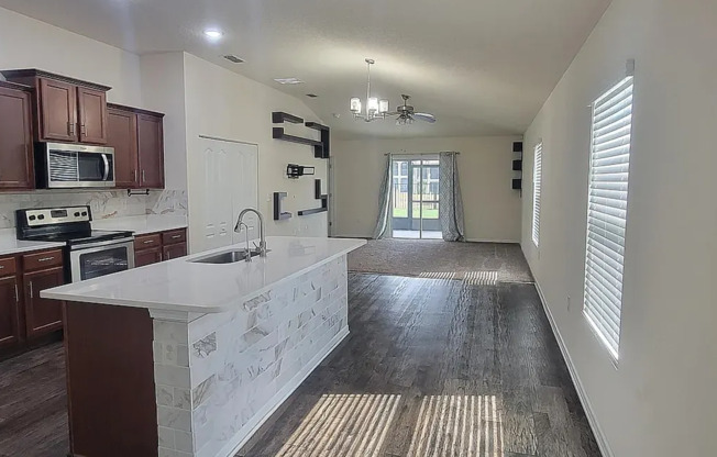 Charming 3/2 in a prime location with multiple upgrades including attache garage and screened in lanai