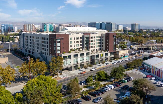 Aerial view of the community showcasing rooftop spaces and easy access to the surrounding neighborhood.