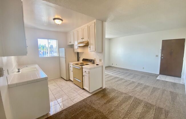 Upper Corner Unit with Utilities INCLUDED!!