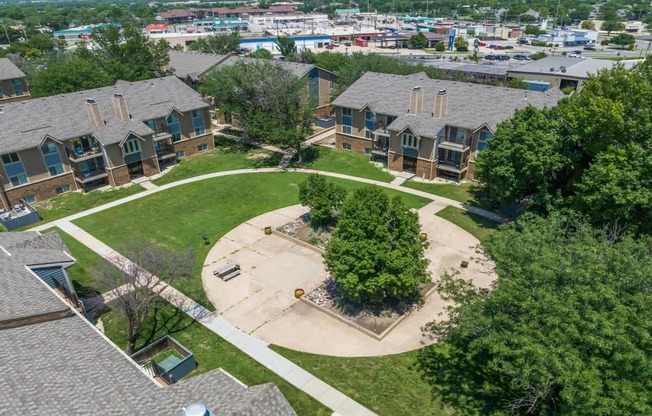 an aerial view of a neighborhood with houses and trees