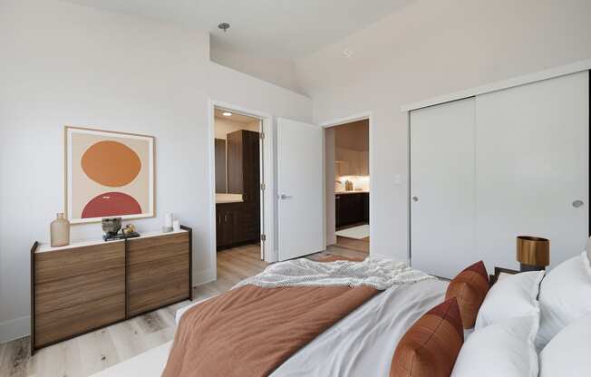a bedroom with a bed and a closet and a bathroom at Track 281 Apartments, Sacramento, 95811