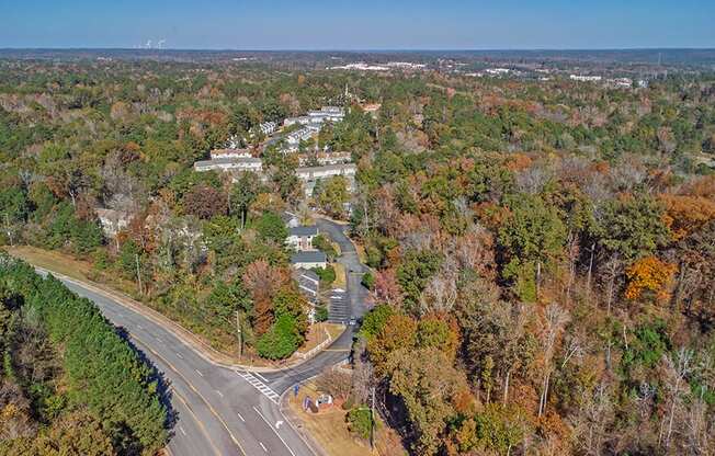 Element at 4411 Macon Apartments A road with a curve and a crosswalk in the middle of it.
