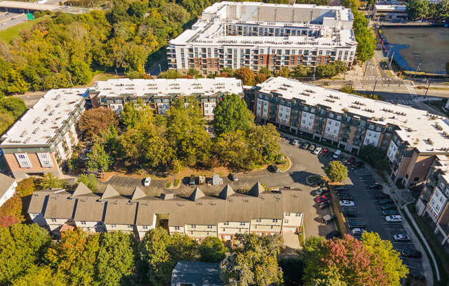 Flatiron West Trade Apartments aerial view with Charlotte skyline in background