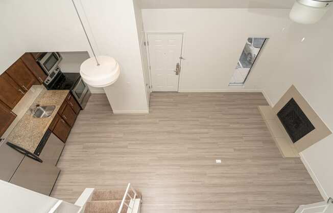 a view of the kitchen and living room from the loft